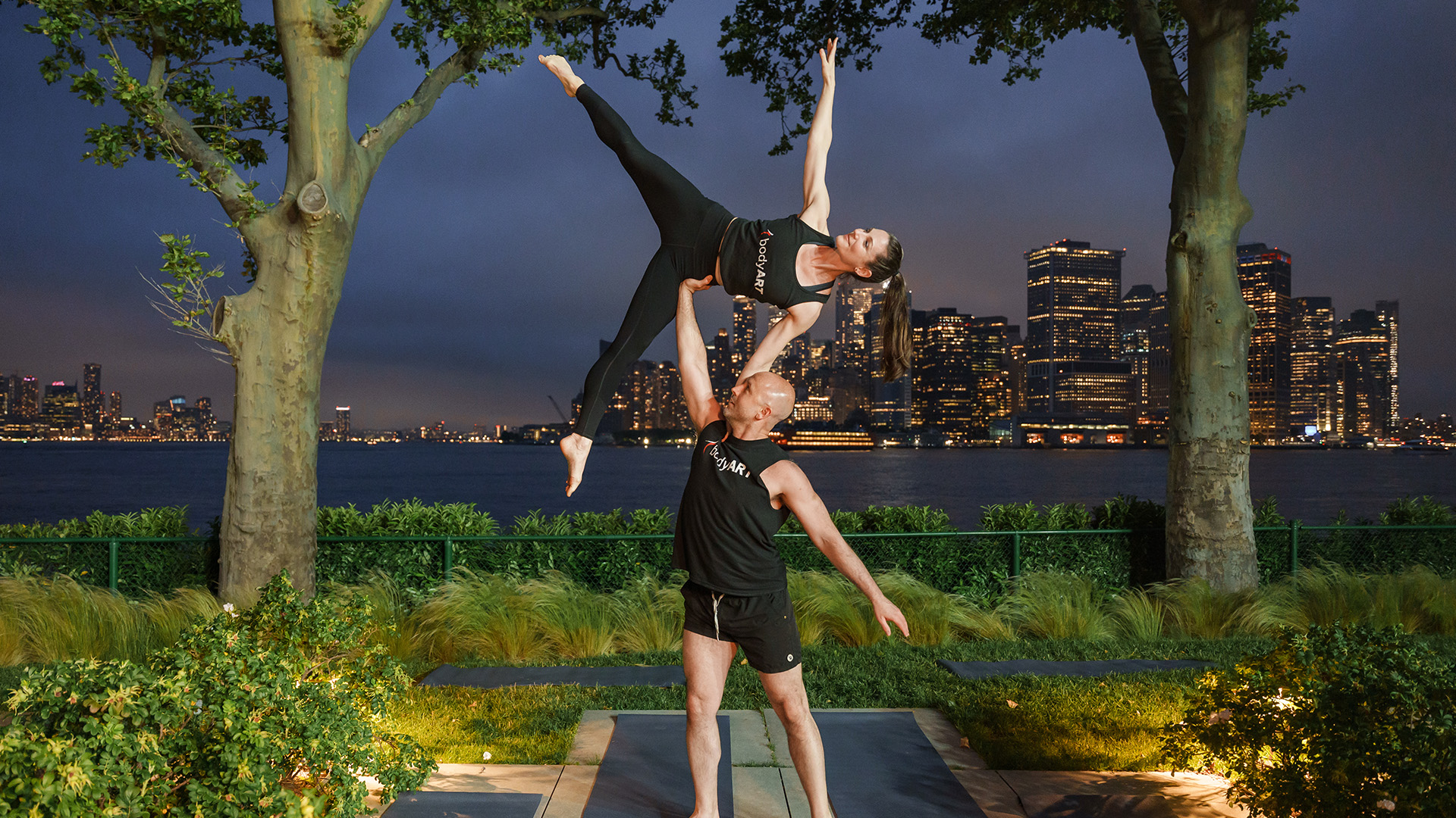 couple enjoying sunset yoga